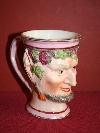 A Staffordshire porcelain satyr's mask mug, United Kingdom, c. 1820. - Picture 01